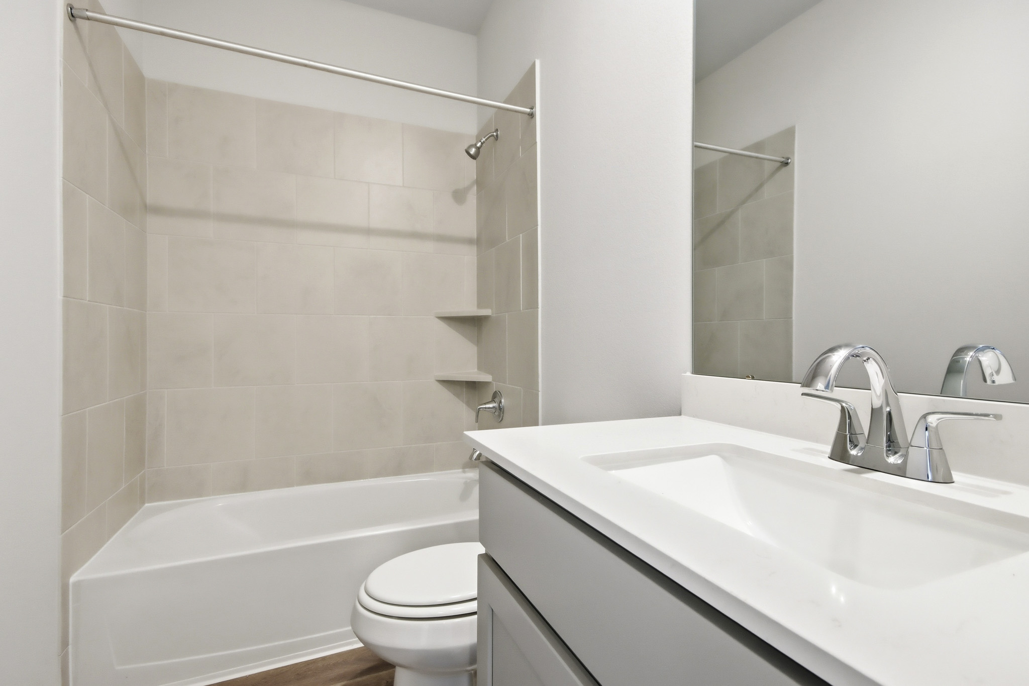 A bathroom with a sink and a toilet.