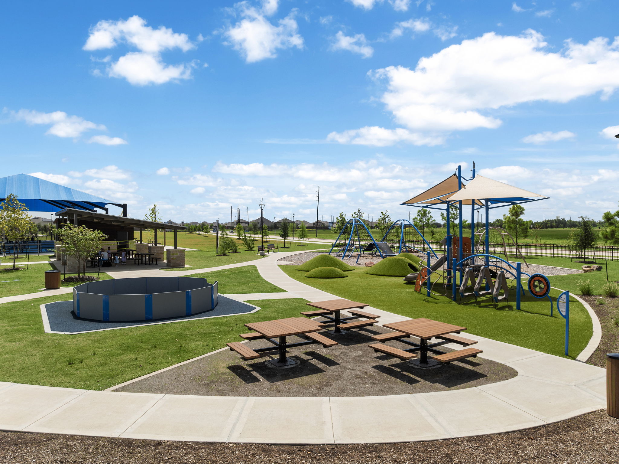 A large outdoor area with a playground in the background.