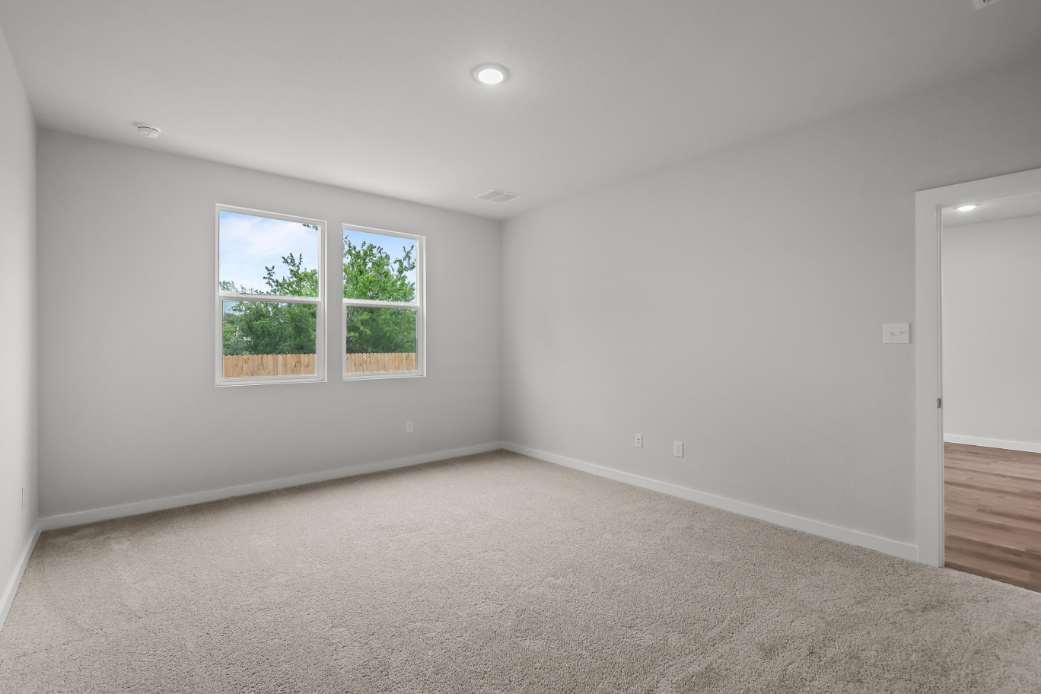 A room with a window and a door.
