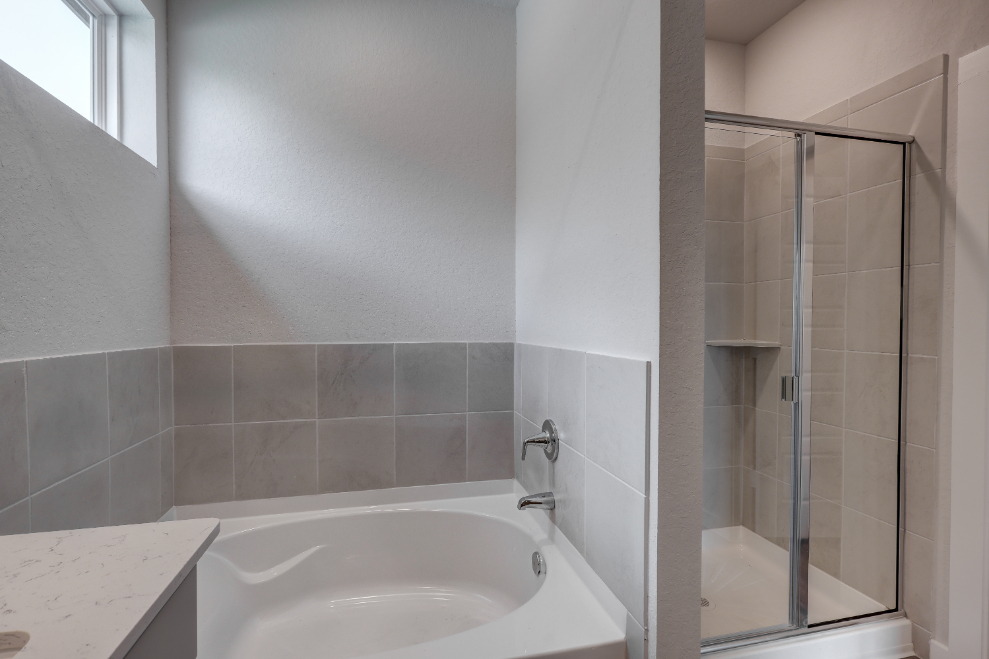 A bathroom with a glass shower.