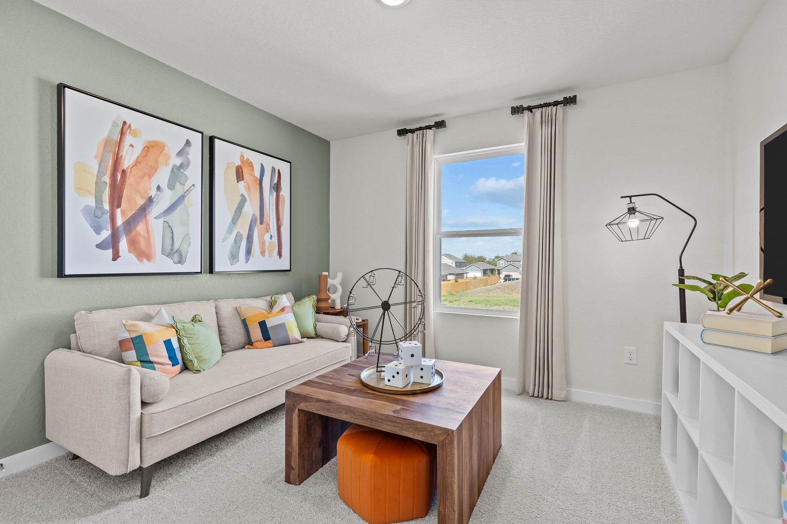 A living room with a couch and a table.