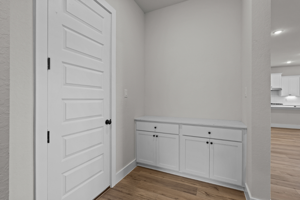 A white cabinet in a room.