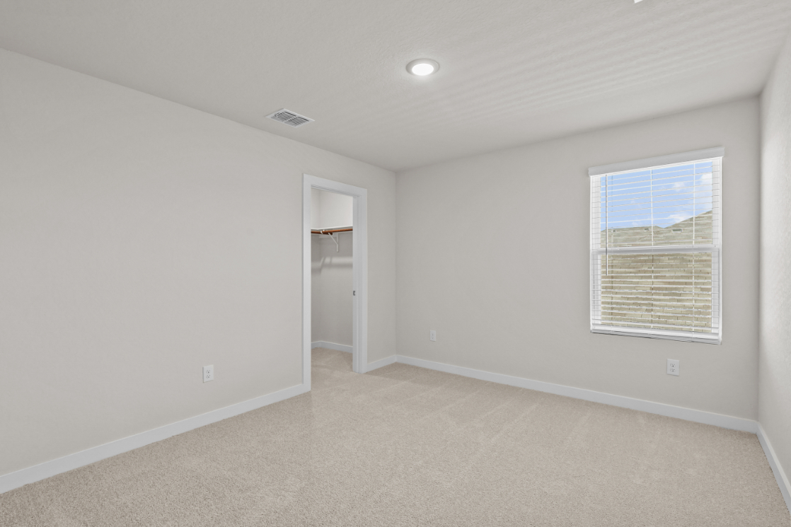 A room with a window and a door.