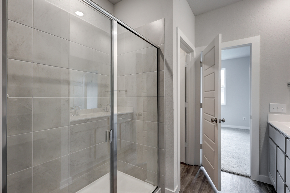 A shower with glass doors.