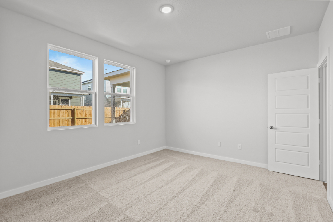 A room with a window and a door.