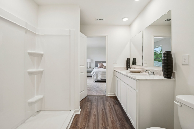 A bathroom with a sink and a mirror.
